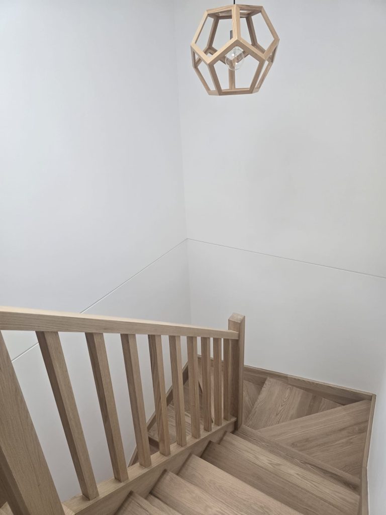 Natural timber balustrade around a stair void and landing