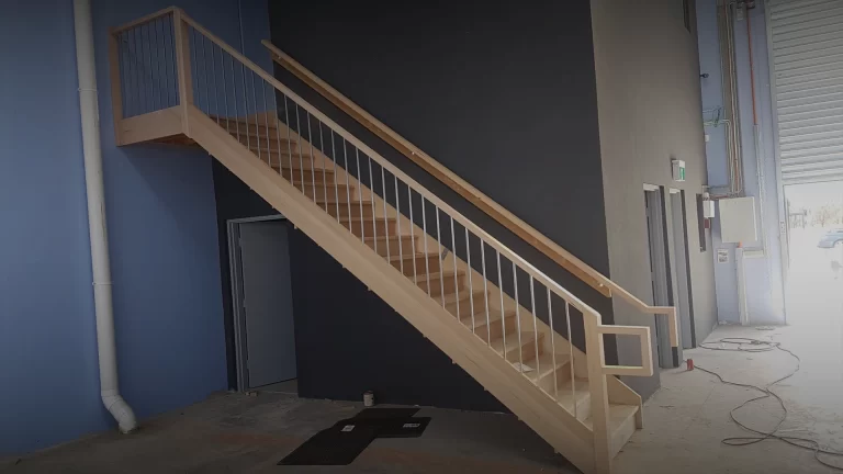 Banner image of a commercial timber staircase and landing