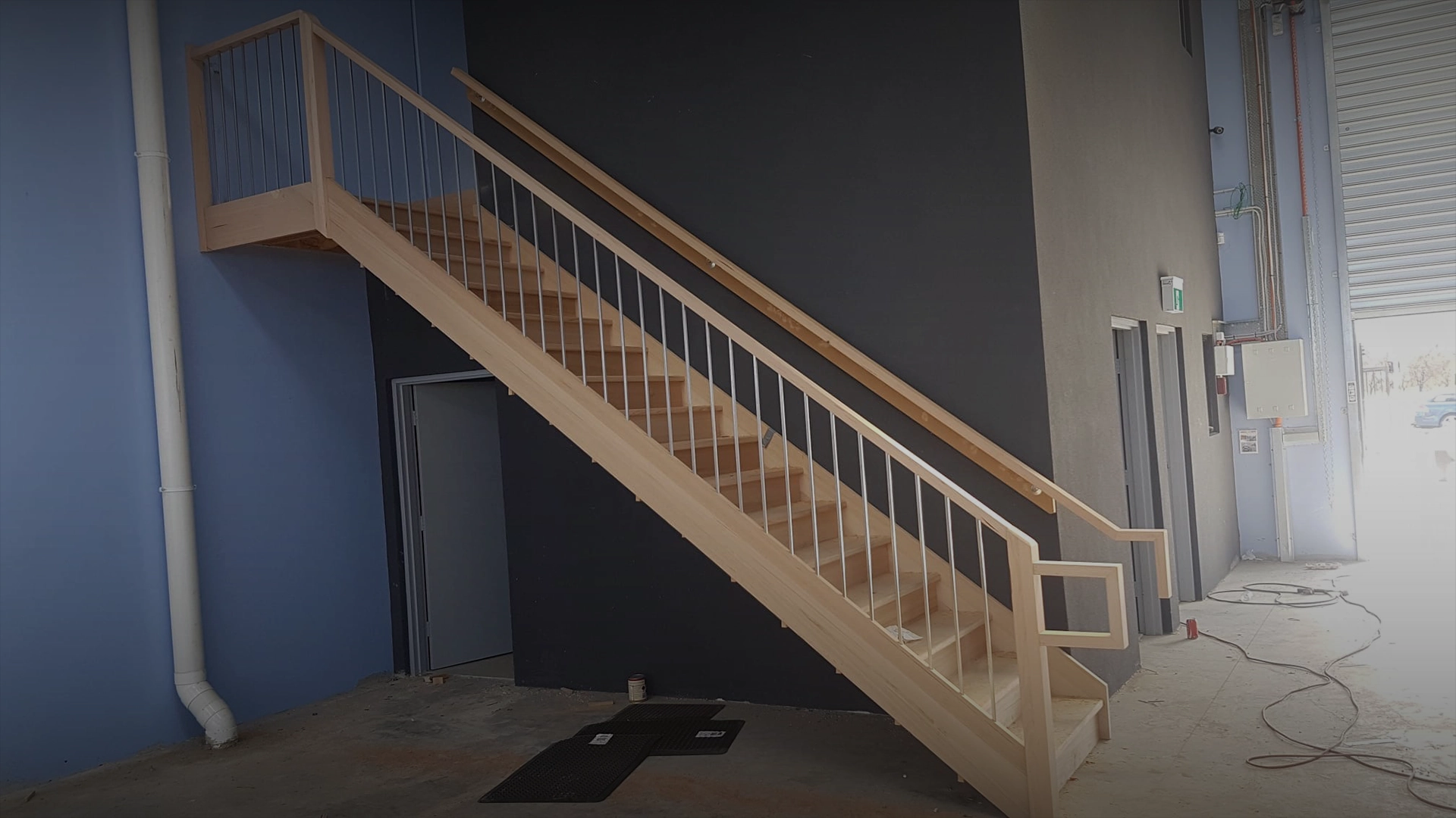Banner slider showing commercial timber staircase and landing