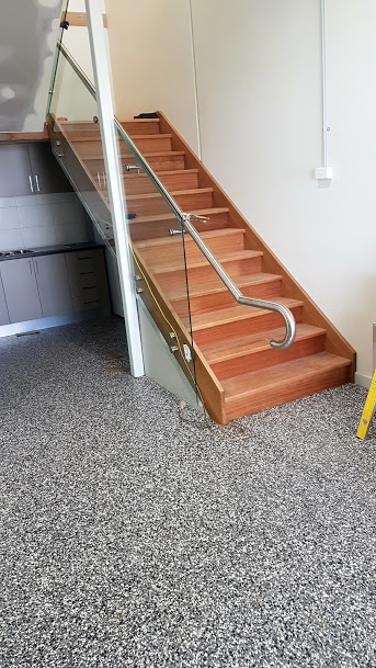 Timber stairs with additional safety handrails for senior access