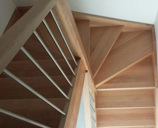 Timber staircase corner with wire balustrade and landing