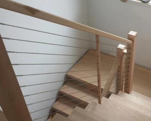 Timber staircase with horizontal wire balustrade detail