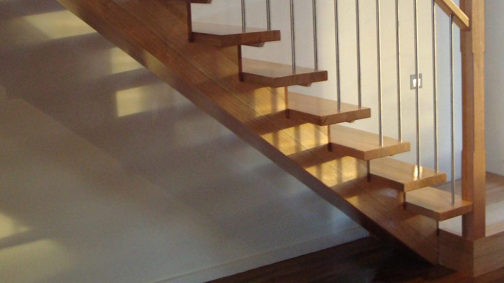 Timber staircase with under-tread lighting in a modern interior