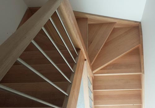 Timber staircase with stainless steel wire balustrade detail
